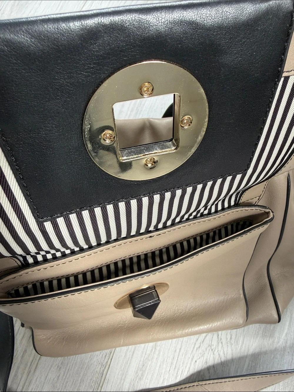 kate spade Taupe and Black Leather Satchel with Front Emblem